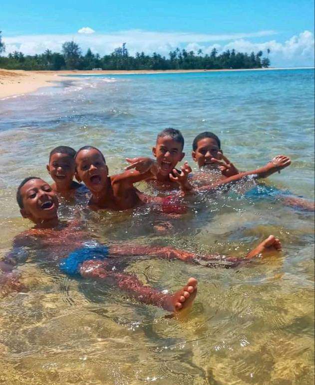 Kids playing in the ocean